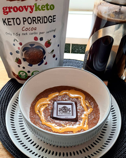 Groovy Keto Cocoa Porridge topped with Dark Chocolate and Peanut Butter